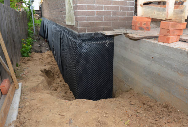 Happy homeowners after waterproofing job in Wood Dale